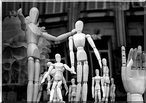 wooden dolls in group