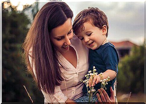 Mother and child looking at flowers