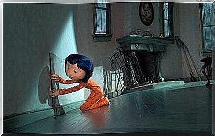 Coraline opens a door in the wall