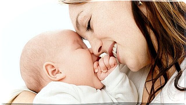 Mom smiles at the baby