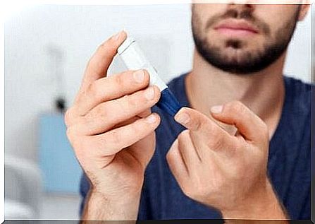 A man with diabetes checks his blood sugar