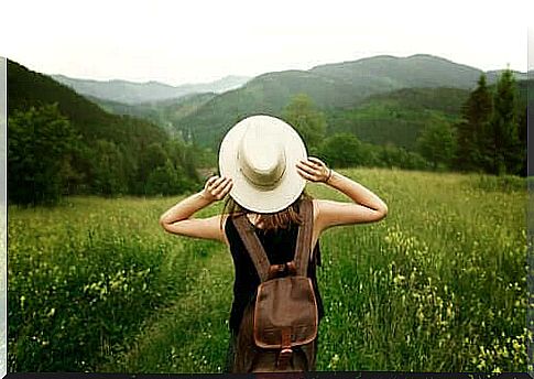 Woman in nature has stopped holding on to things