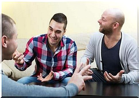 Three friends sitting around a table.