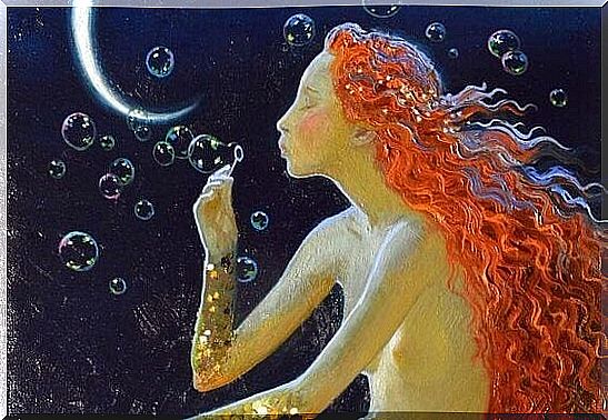 A mermaid blows soap bubbles