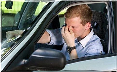 Tired man in car