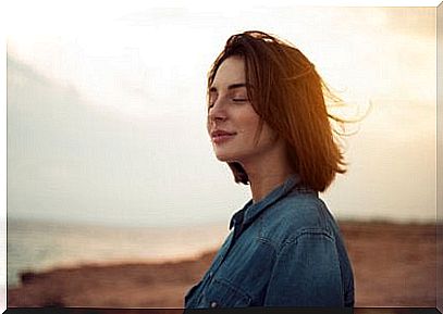 A woman smiling in the wind