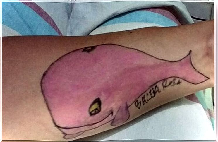 pink whale tattoo