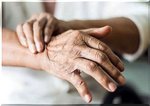 An old woman suffering from trembling hands.