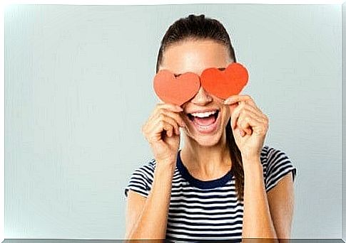 Woman with hearts in front of her eyes.